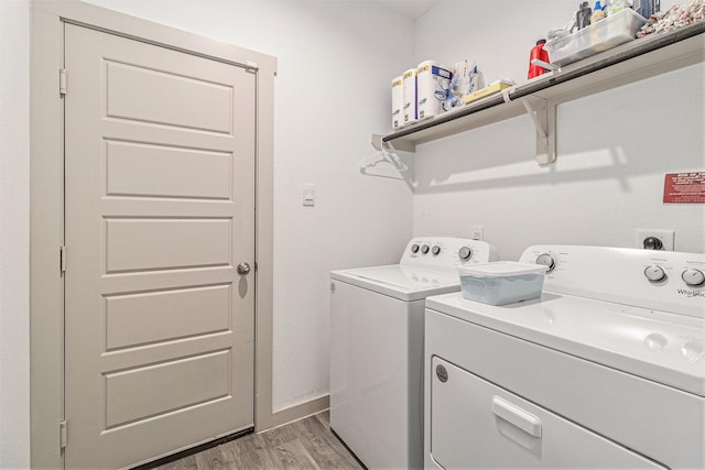 laundry room with independent washer and dryer, laundry area, baseboards, and light wood-type flooring
