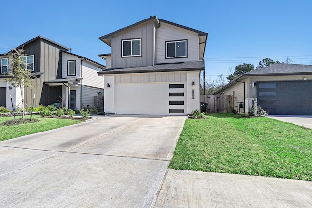 12823 Tokenhouse Ln, Houston, TX 77047 - view of front of home with board and batten siding, driveway, and a garage