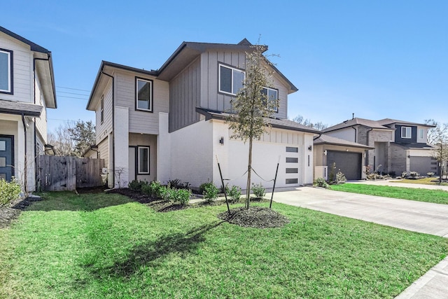 12823 Tokenhouse Ln, Houston, TX 77047 - view of front of house featuring board and batten siding, driveway, and a garage