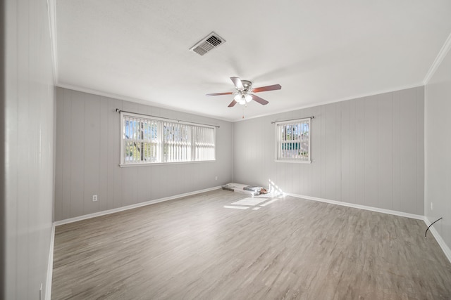 29133 E Lake Dr, Hempstead, TX 77445 - unfurnished room featuring ceiling fan, visible vents, crown molding, wood finished floors, and baseboards
