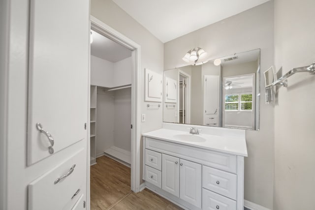 29133 E Lake Dr, Hempstead, TX 77445 - bathroom featuring vanity, a ceiling fan, wood finished floors, and visible vents