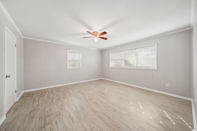 29133 E Lake Dr, Hempstead, TX 77445 - spare room with crown molding, light wood-style flooring, ceiling fan, and baseboards