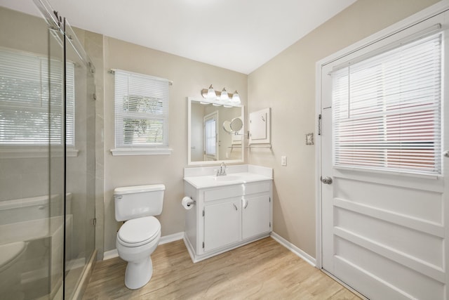 29133 E Lake Dr, Hempstead, TX 77445 - full bath with vanity, a shower stall, toilet, and wood finished floors