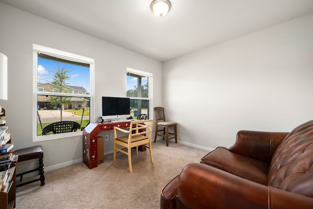home office with carpet floors and baseboards