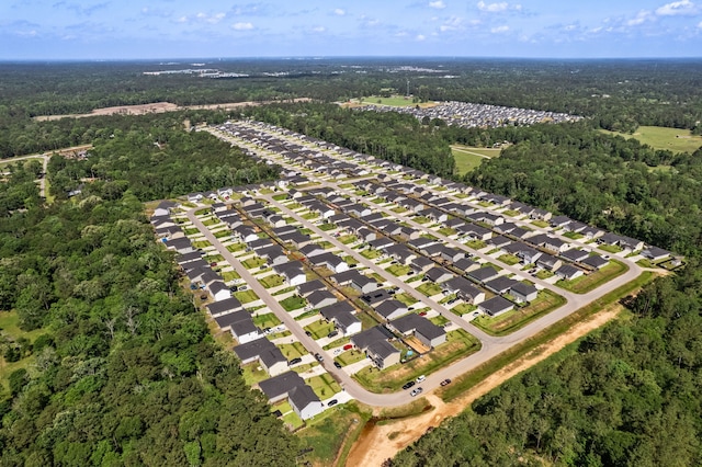 aerial view with a residential view and a wooded view