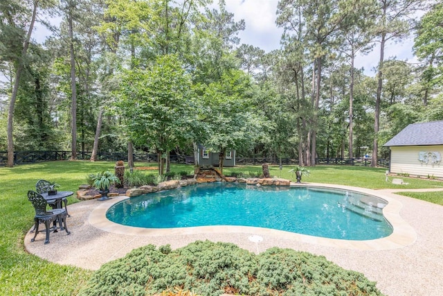 pool with a lawn and an outbuilding