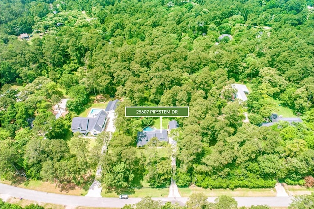 aerial view featuring a wooded view