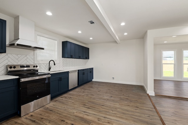 kitchen with visible vents, wood finished floors, custom exhaust hood, tasteful backsplash, and stainless steel appliances