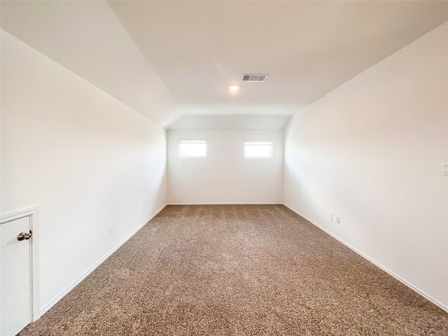 bonus room featuring vaulted ceiling, baseboards, carpet flooring, and visible vents