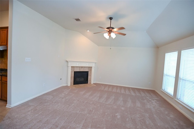 unfurnished living room featuring light colored carpet, ceiling fan, vaulted ceiling, and visible vents