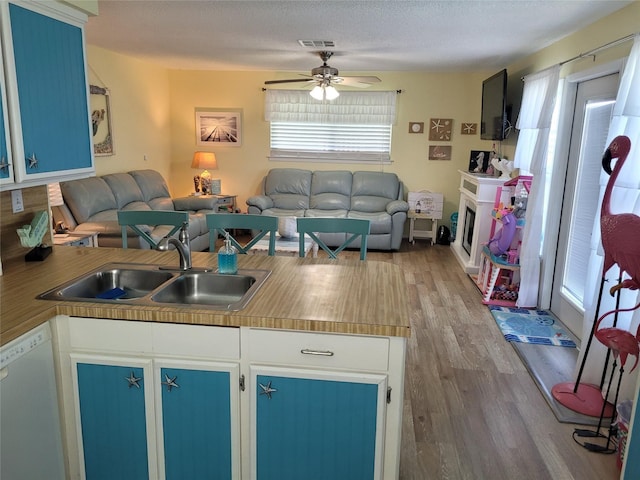 16607 Henry Morgan Rd, Jamaica Beach, TX 77554 - kitchen with a sink, dishwasher, a ceiling fan, open floor plan, and visible vents