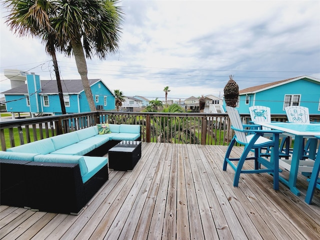 16607 Henry Morgan Rd, Jamaica Beach, TX 77554 - deck featuring outdoor dining area, a residential view, and an outdoor hangout area
