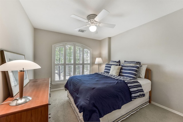 bedroom with carpet flooring, baseboards, visible vents, and ceiling fan