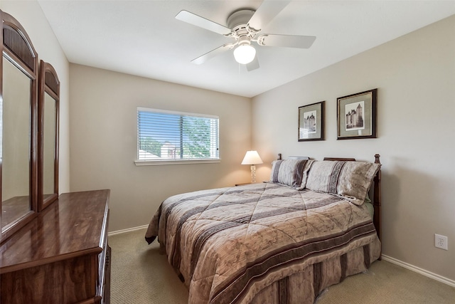 bedroom featuring baseboards, a ceiling fan, and carpet flooring