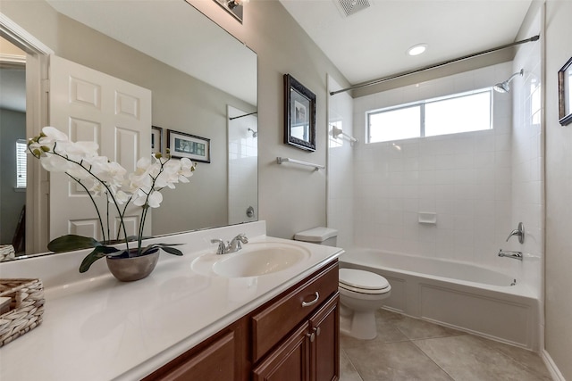 full bath with visible vents, vanity, toilet, shower / tub combination, and tile patterned floors