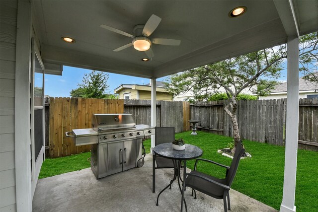 view of patio / terrace with a ceiling fan and a fenced backyard