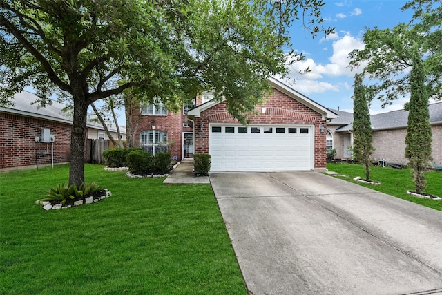 view of front of home with brick siding, a garage, driveway, and a front yard