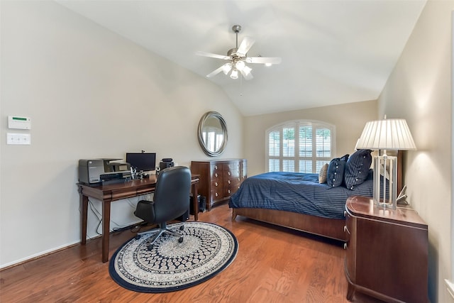 bedroom with lofted ceiling, wood finished floors, and ceiling fan