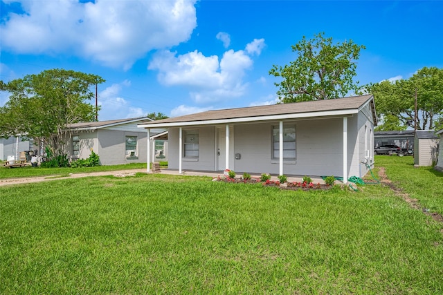 ranch-style home with a porch and a front yard