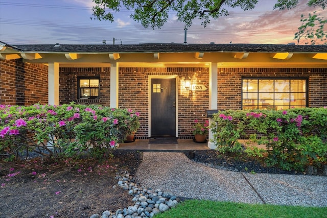 1033 Gardendale Dr, Houston, TX 77018 - view of exterior entry featuring brick siding