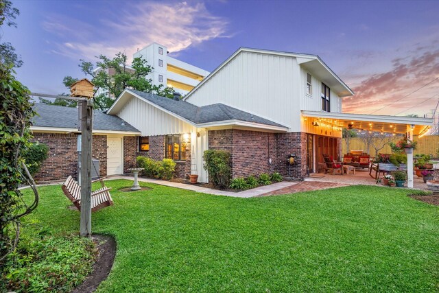 1033 Gardendale Dr, Houston, TX 77018 - rear view of property with a lawn, a patio, and brick siding