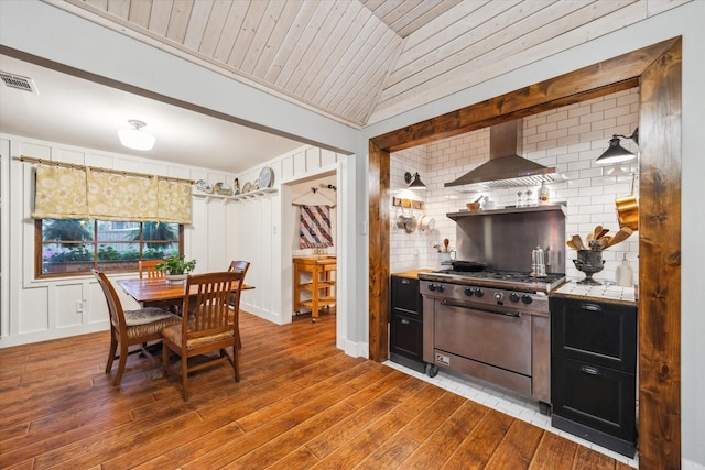 1033 Gardendale Dr, Houston, TX 77018 - kitchen featuring visible vents, stainless steel stove, wall chimney range hood, wood ceiling, and light wood-style flooring