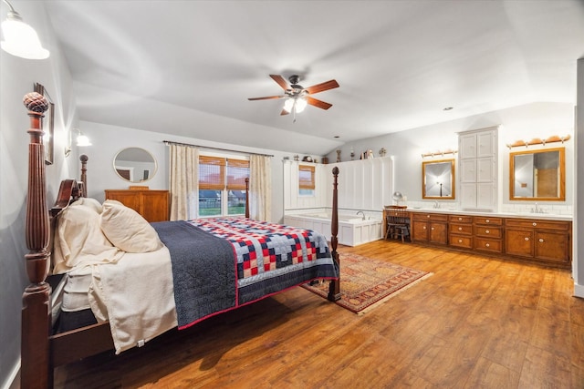 1033 Gardendale Dr, Houston, TX 77018 - bedroom with a sink, vaulted ceiling, and light wood-style flooring