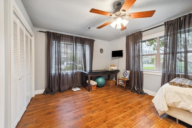 1033 Gardendale Dr, Houston, TX 77018 - bedroom featuring visible vents, a closet, baseboards, ceiling fan, and hardwood / wood-style flooring