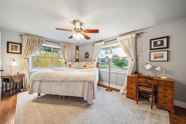 1033 Gardendale Dr, Houston, TX 77018 - bedroom with baseboards, ceiling fan, and wood finished floors