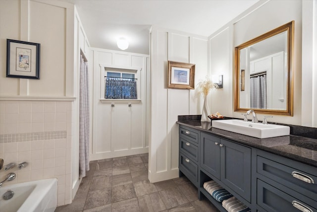 1033 Gardendale Dr, Houston, TX 77018 - bathroom featuring vanity, a bathing tub, a decorative wall, and a shower with curtain