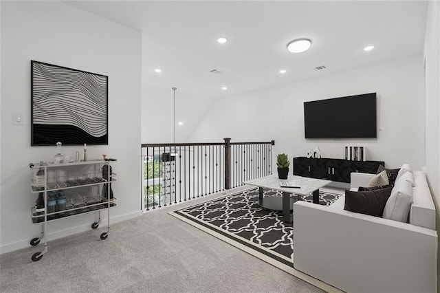 carpeted living room featuring recessed lighting, baseboards, and visible vents