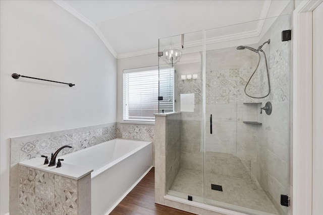 20422 Barrel Run Dr, Hockley, TX 77447 - full bathroom featuring ornamental molding, a stall shower, a bath, lofted ceiling, and wood finished floors