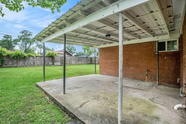 view of patio / terrace featuring a fenced backyard and a carport