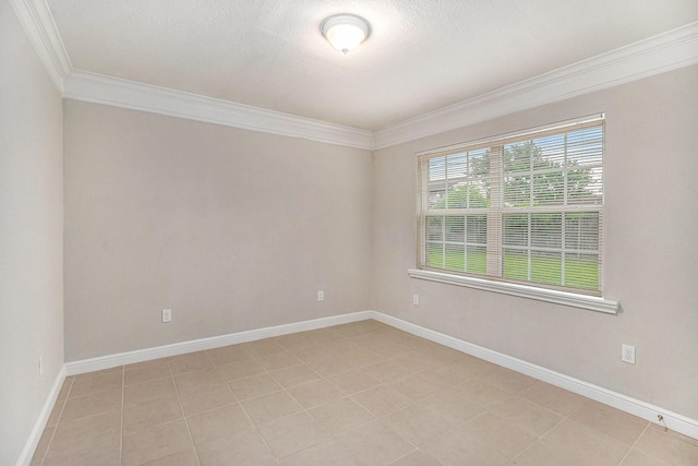 unfurnished room with baseboards, ornamental molding, and light tile patterned floors