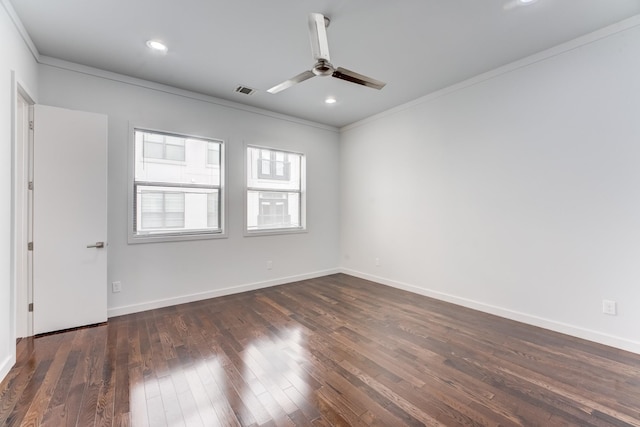 empty room featuring crown molding, baseboards, a ceiling fan, and dark wood-type flooring