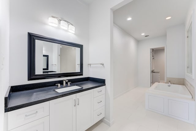 full bathroom with vanity, tile patterned floors, recessed lighting, visible vents, and a bath