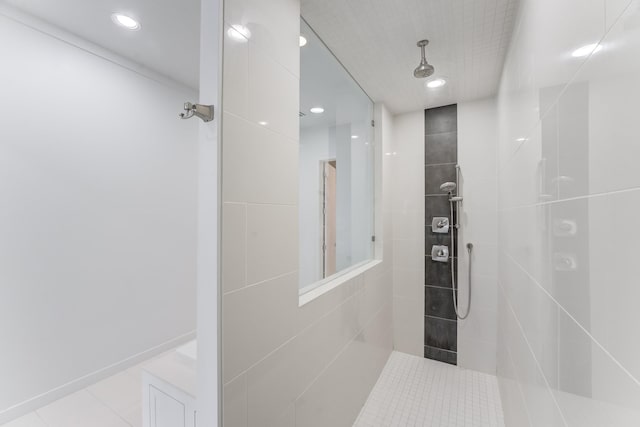 full bathroom featuring tile patterned flooring, a tile shower, and recessed lighting