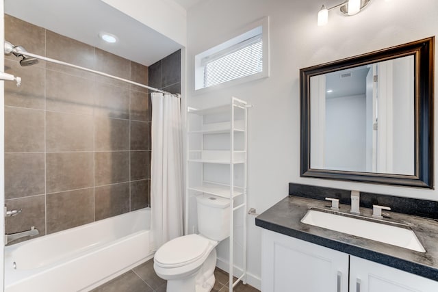 bathroom with tile patterned flooring, vanity, toilet, shower / bathtub combination with curtain, and baseboards