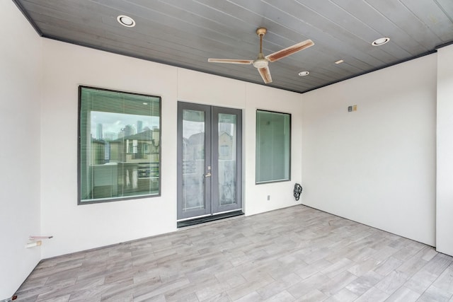 empty room with wood ceiling, ceiling fan, recessed lighting, and wood finished floors