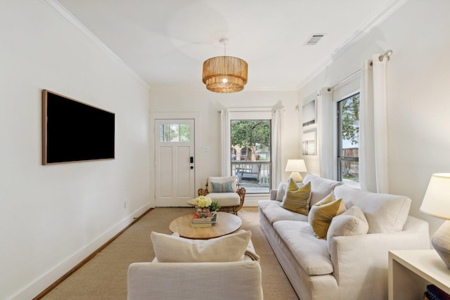 living room with baseboards, ornamental molding, and visible vents