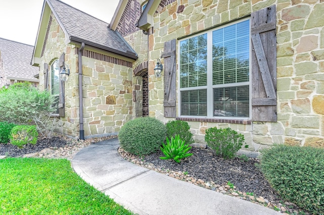 view of exterior entry with stone siding
