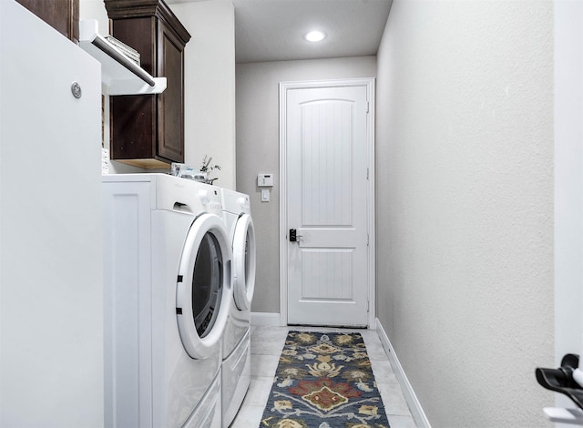 laundry room featuring cabinet space, recessed lighting, baseboards, and washing machine and dryer