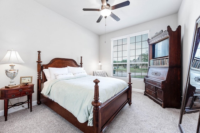 bedroom with baseboards, light colored carpet, and ceiling fan
