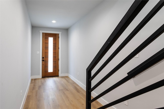 711 Boundary St, Houston, TX 77009 - entrance foyer with recessed lighting, baseboards, stairway, and light wood-style floors
