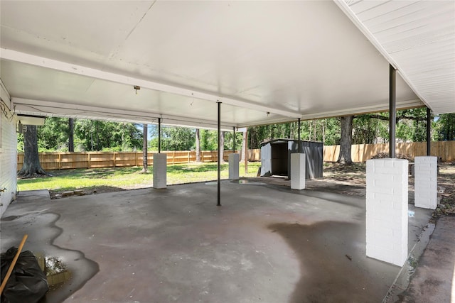 1403 Marilyn St, Conroe, TX 77301 - view of patio with a shed and an outbuilding