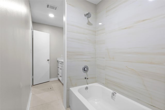 bathroom featuring visible vents, shower / tub combination, vanity, baseboards, and tile patterned floors