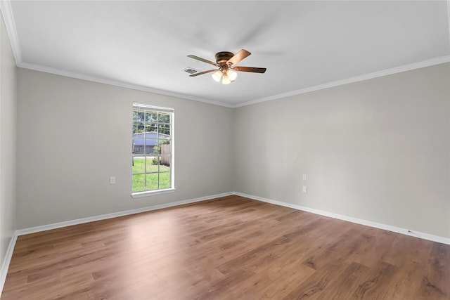 empty room with baseboards, ceiling fan, and light wood-style flooring