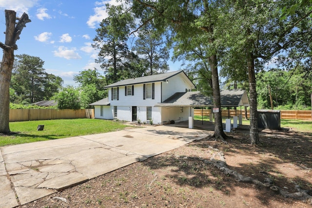 1403 Marilyn St, Conroe, TX 77301 - view of front of house with concrete driveway, an attached carport, and a shingled roof