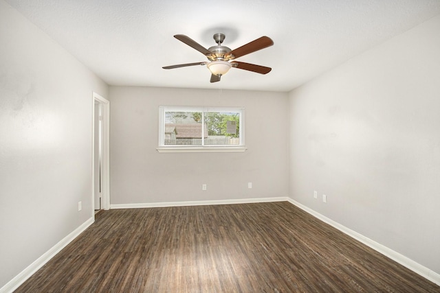 3622 Pine Ridge Ln, Houston, TX 77088 - empty room featuring baseboards, a ceiling fan, and dark wood finished floors