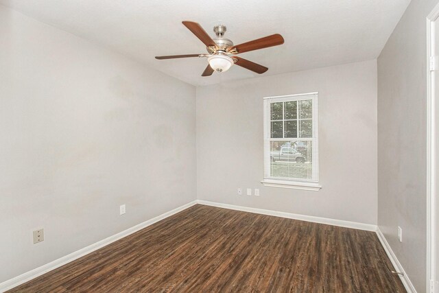 3622 Pine Ridge Ln, Houston, TX 77088 - spare room with dark wood-type flooring, baseboards, and ceiling fan